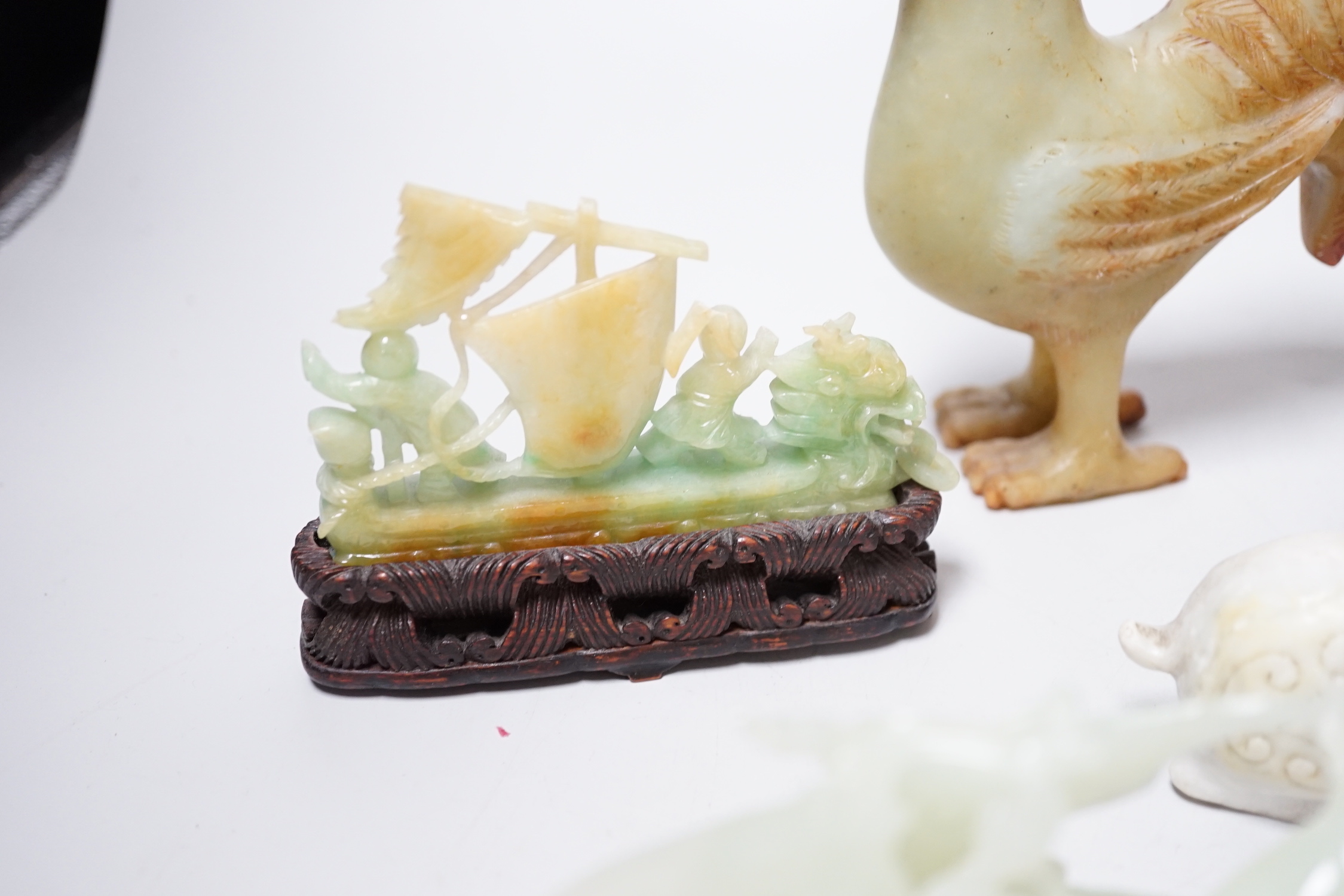A group of four Chinese bowenite jade and hardstone carvings, the ‘sea creatures’ vase and cover, 18 cm high excluding wood stand
